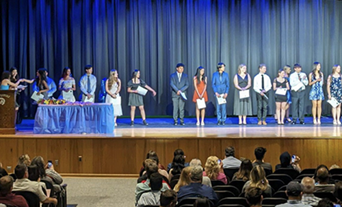 PHS students walking on stage during ceremony