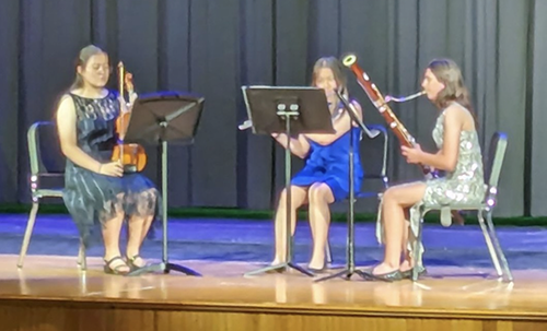 PHS students on stage playing musical instruments