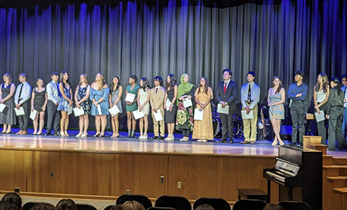 PHS students on stage during ceremony being honored