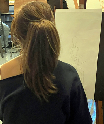 Closeup of student's figure drawing